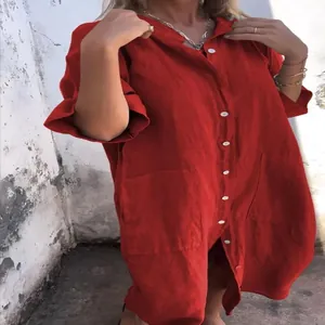 Detailed view of women's red loose-fitting cotton linen shirt dress with buttons