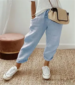 Comfortable light blue linen cropped pants with elastic waist and drawstring detail