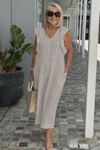 Elegant summer linen dress with ruffle sleeves and V-neck in light grey lifestyle view