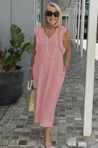 Detail of pink cotton linen maxi dress featuring stylish ruffle sleeves and V-neckline