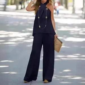 Elegante set due pezzi da donna con top allacciato al collo e pantaloni larghi blu navy