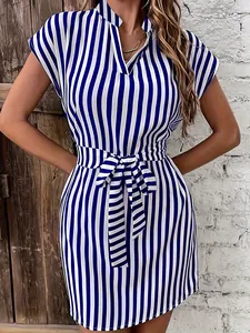 Close-up of blue and white striped dress featuring batwing sleeves and a waist tie
