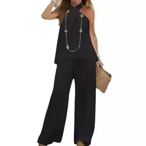 Elegante completo da donna nero due pezzi con top a fascia e pantaloni larghi