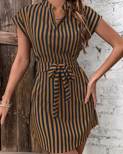 Detail of a blue and mustard vertical striped dress with batwing sleeves and tie waist.