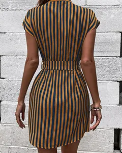 Detailed back view of a chic navy and yellow striped batwing sleeve dress with belt.
