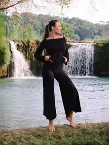 Elegant black high-waisted wide-leg yoga set with asymmetric irregular hem pants for women