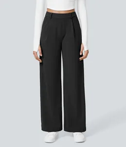 Close-up of black wide-leg suit pants for women with front pleats and side pockets