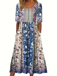 Close-up detail of a bohemian printed maxi dress with vibrant floral and geometric patterns.