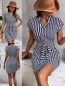 Stylish black and white striped mini dress with batwing sleeves and waist tie detail