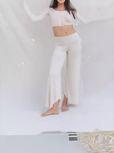 Elegant cream high-waisted irregular wide-leg yoga pants and long-sleeve crop top set