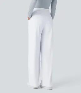 Detailed back view of women's elegant white wide-leg loose suit trousers with pockets