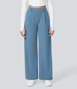 Close-up of light blue wide-leg suit pants with front pleats and high waist design.