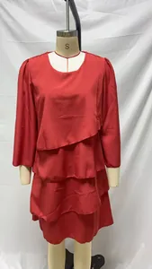 Red tiered long sleeve dress with round neck displayed on a mannequin.
