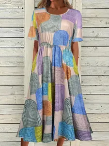 Detailed view of bohemian geometric print maxi dress with round neck and short sleeves.