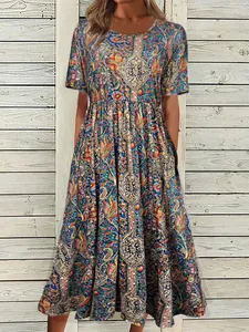 Detail view of Bohemian paisley print maxi dress with round neck and short sleeves