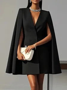 Detail view of a black double-breasted cape blazer dress for an elegant style.