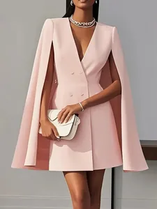 Close-up of pink double-breasted cape blazer dress with elegant V-neck detail