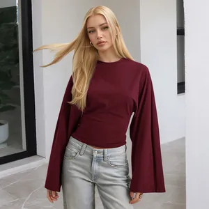 Elegant burgundy slim fit long sleeve top with round neck and dramatic flare sleeves