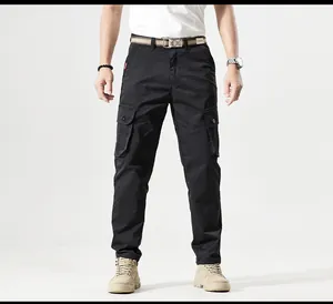 Professional front view of men's black multi-pocket cargo pants on a model studio