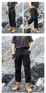 Men's black techwear cargo pants with multiple pockets shown in an outdoor rocky scene