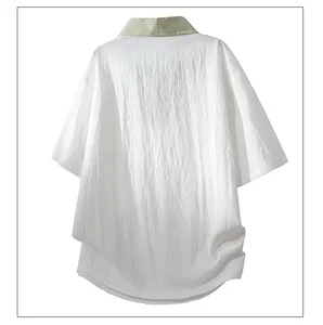 Back view of a men's loose white Lyocell T-shirt with a light green lapel collar.