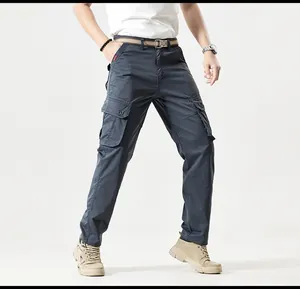 Full length detail view of men's vintage multi-pocket cargo pants in dark grey color