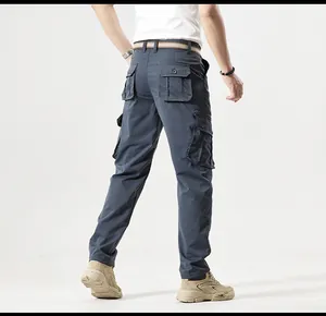 Back view of dark grey multi-pocket cargo pants showing durable fabric and tactical design