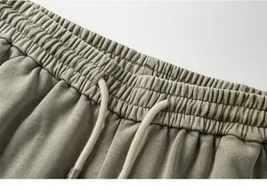 Detailed view of elastic waistband with adjustable drawstring on men's casual cargo shorts