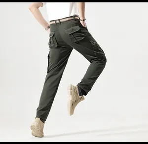 Detailed rear view of olive green outdoor cargo pants with multi-pocket tactical design