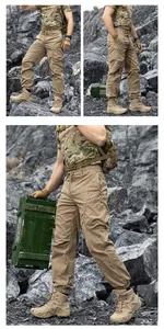 Men's khaki techwear cargo pants with multiple pockets and elastic cuffs in outdoor setting