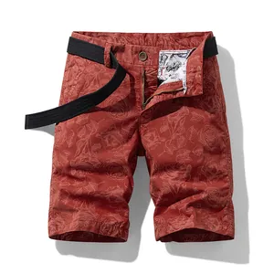 Trendy men's summer cargo shorts featuring a red rose floral print and black canvas belt