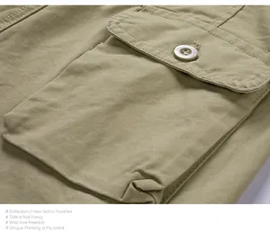 Primo piano del resistente tessuto twill e della tasca cargo laterale con bottone sui pantaloncini.