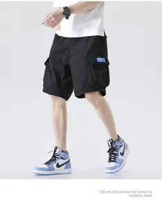 Side view of men's black multi-pocket cargo shorts featuring a small blue label