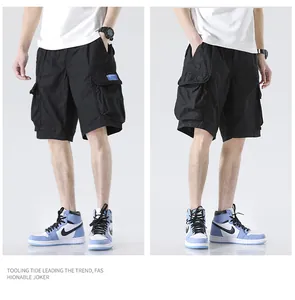 Detailed view of men's relaxed-fit multi-pocket black cargo shorts for summer outdoor activities