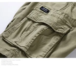 Detailed macro view of side cargo pocket and woven label on men's vintage green cotton shorts.