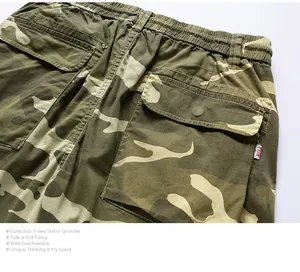 Detailed view of the back pockets and elastic waist on men's camouflage cargo shorts.