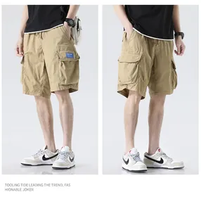 Detailed view of men's loose khaki cargo shorts with multi-pocket design on model.