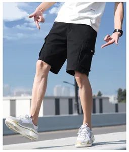 Men's loose black cotton cargo shorts with multiple flap pockets for outdoor wear
