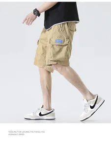 Detailed side view of khaki men's loose multi-pocket cargo shorts on a walking model