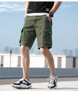 Close-up detail of men's olive green cargo shorts with multiple pockets on a model