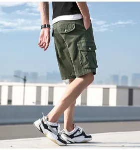 A professional detailed shot of men's olive green multi-pocket cotton cargo shorts