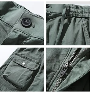 Detailansicht von Reißverschluss, Tasche und Bund der armeegrünen Baumwoll-Cargoshorts.
