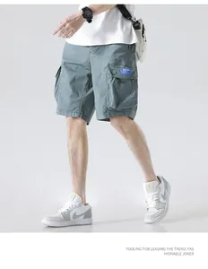 Detail shot of men's multi-pocket cargo shorts in dusty blue with a stylish fit