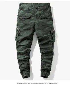 Detailed back view of men's trendy camouflage cargo jogger pants with side zipper pockets