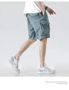 Detailed macro view of men's loose cargo shorts with side pockets and casual styling