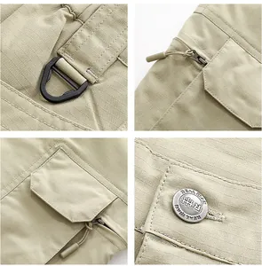 Detailed view of khaki cargo shorts featuring ripstop fabric and metal hardware.