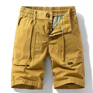 Men's loose cargo shorts with large pockets in mustard yellow, elastic drawstring waist.