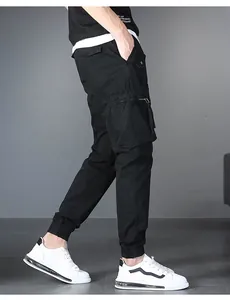 Detailed side view of men's black multi-pocket cargo joggers with elastic cuffs