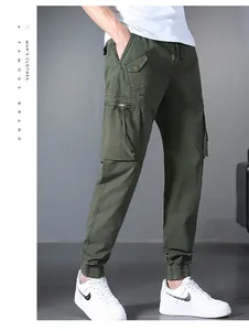 Military green multi-pocket cargo pants for men featuring elastic drawstring cuffs