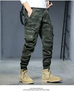 Detailed view of men's vintage camouflage cargo pants with tapered elastic cuffs